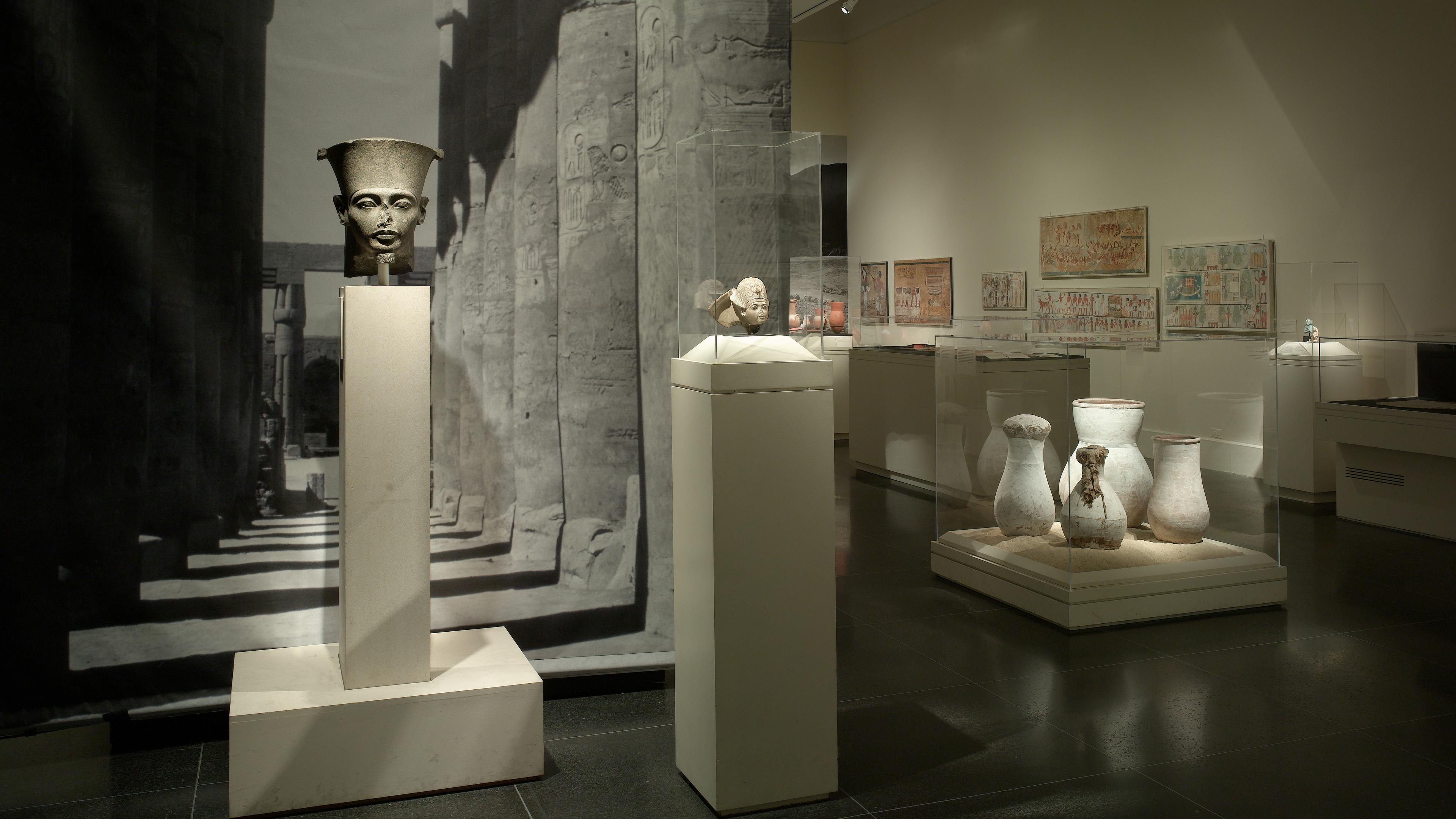 Exhibition showcasing ancient Egyptian artifacts, including sculptures and pottery
